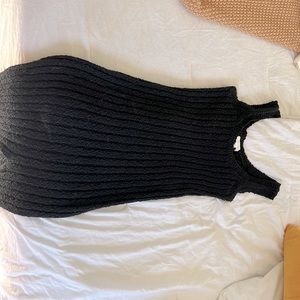 Black knit material dress. Brand All Row size M very stretchy